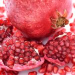 Close up pomegranate and seeds scattered 2021 08 26 18 28 31 utc.jpg