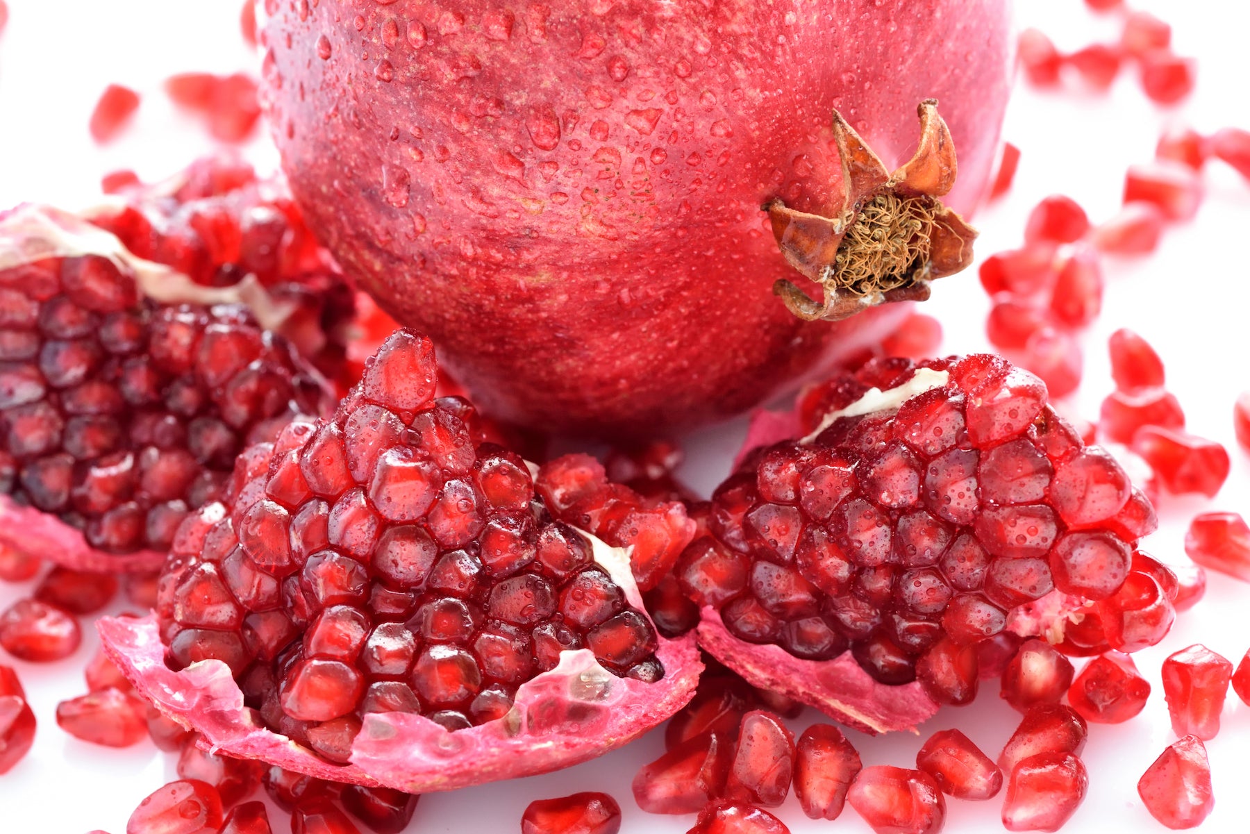 Close up pomegranate and seeds scattered 2021 08 26 18 28 31 utc.jpg