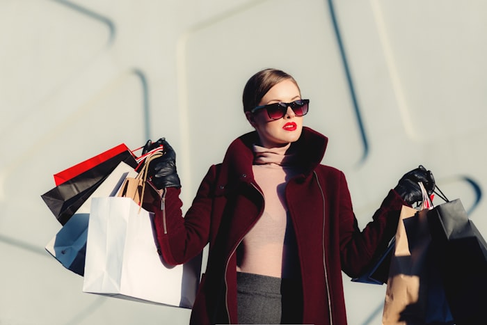 Shopper checking deals on her phone