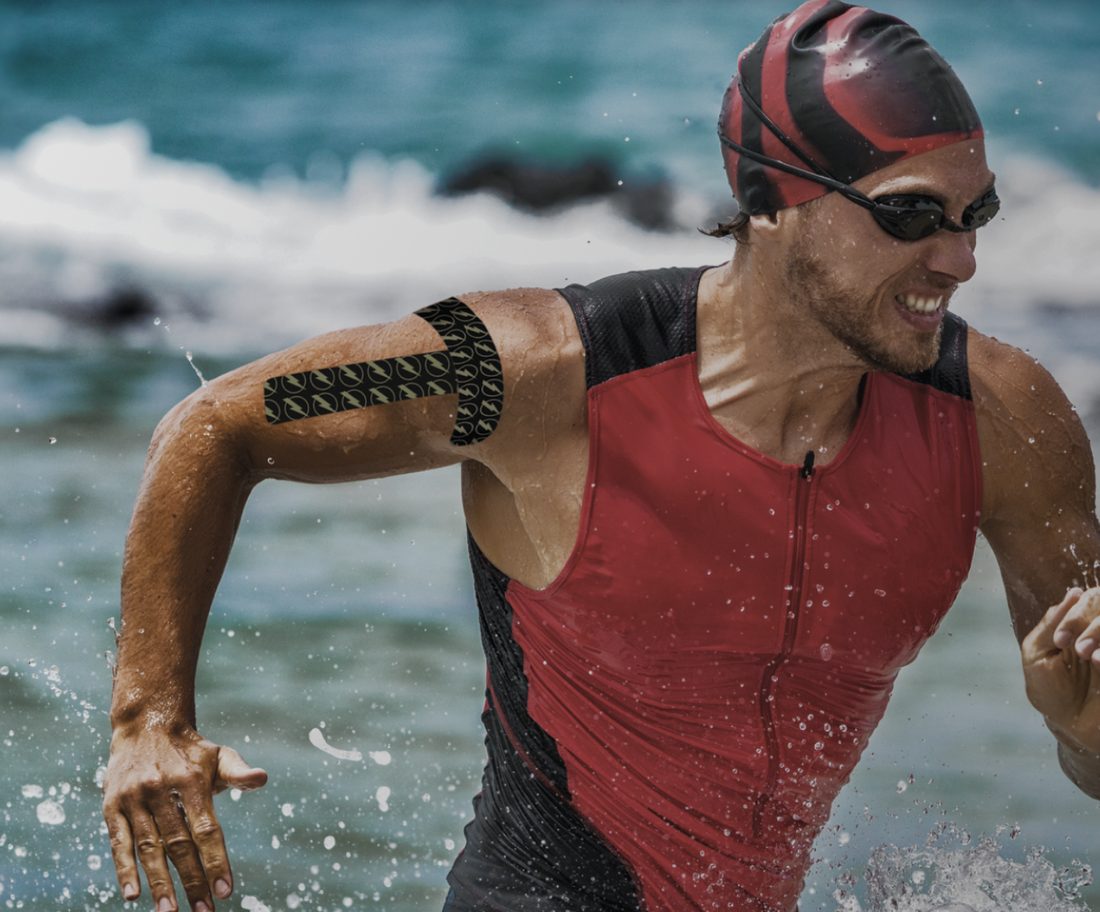 Athlete wearing Thrive Tape Far Infrared Kinesiology Tape